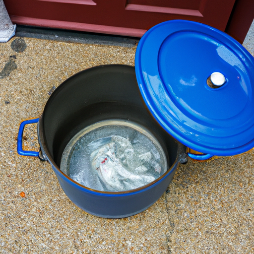 A clean Dutch oven being dried thoroughly after washing.